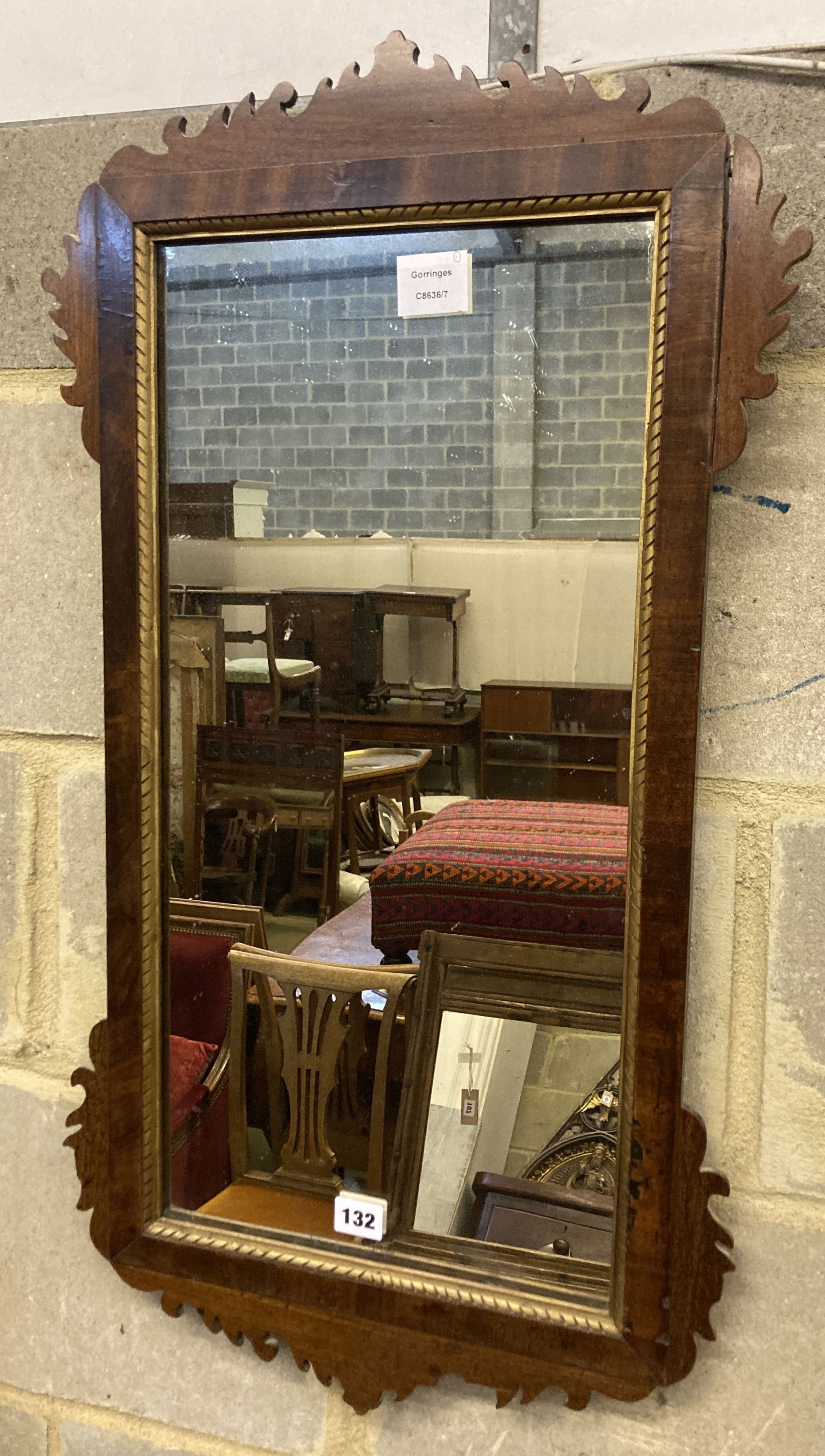 A George III style mahogany fret cut wall mirror, width 42cm, height 80cm